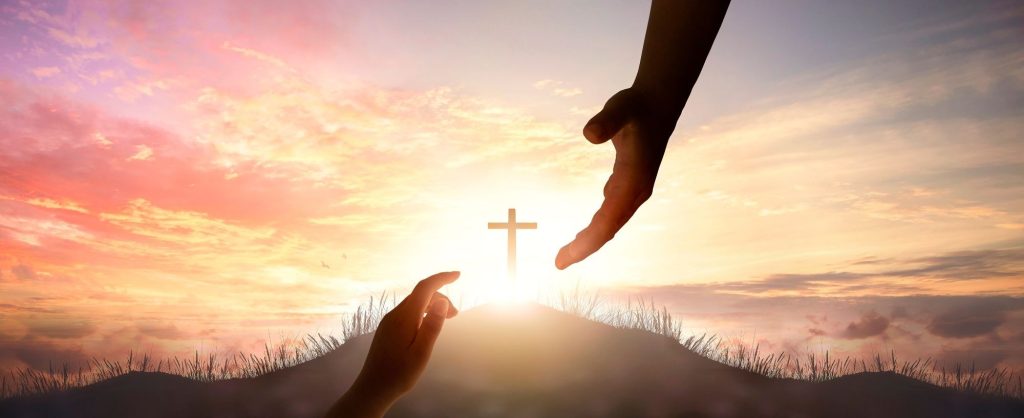 A woman reaching up to Heaven to take God's hand